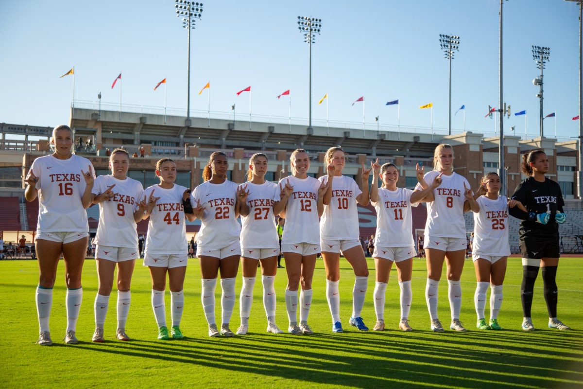 Junior Breana Thompson (22) lined up with her teammates ahead of the Texas' soccer game against A&M on Sept. 29, 2024. 