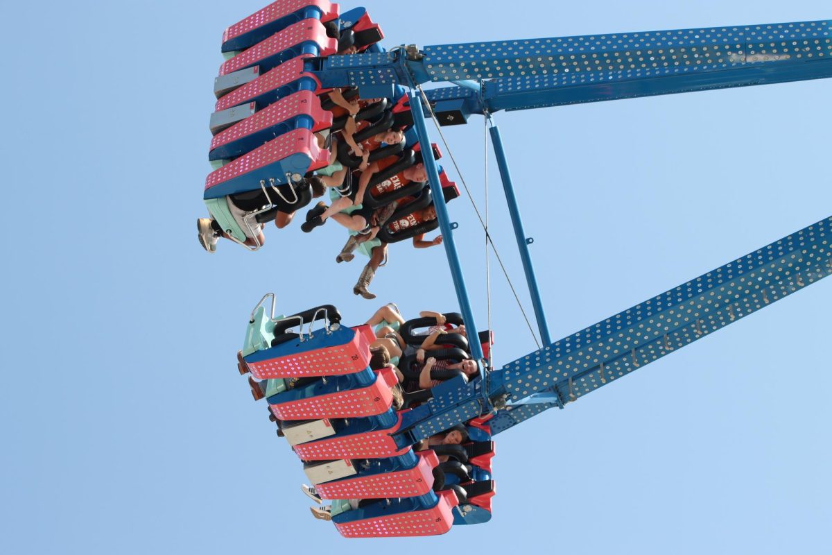 Longhorn fans scream on a ride at the State Fair of Texas prior to the Red River Rivalry on Oct. 12, 2024.