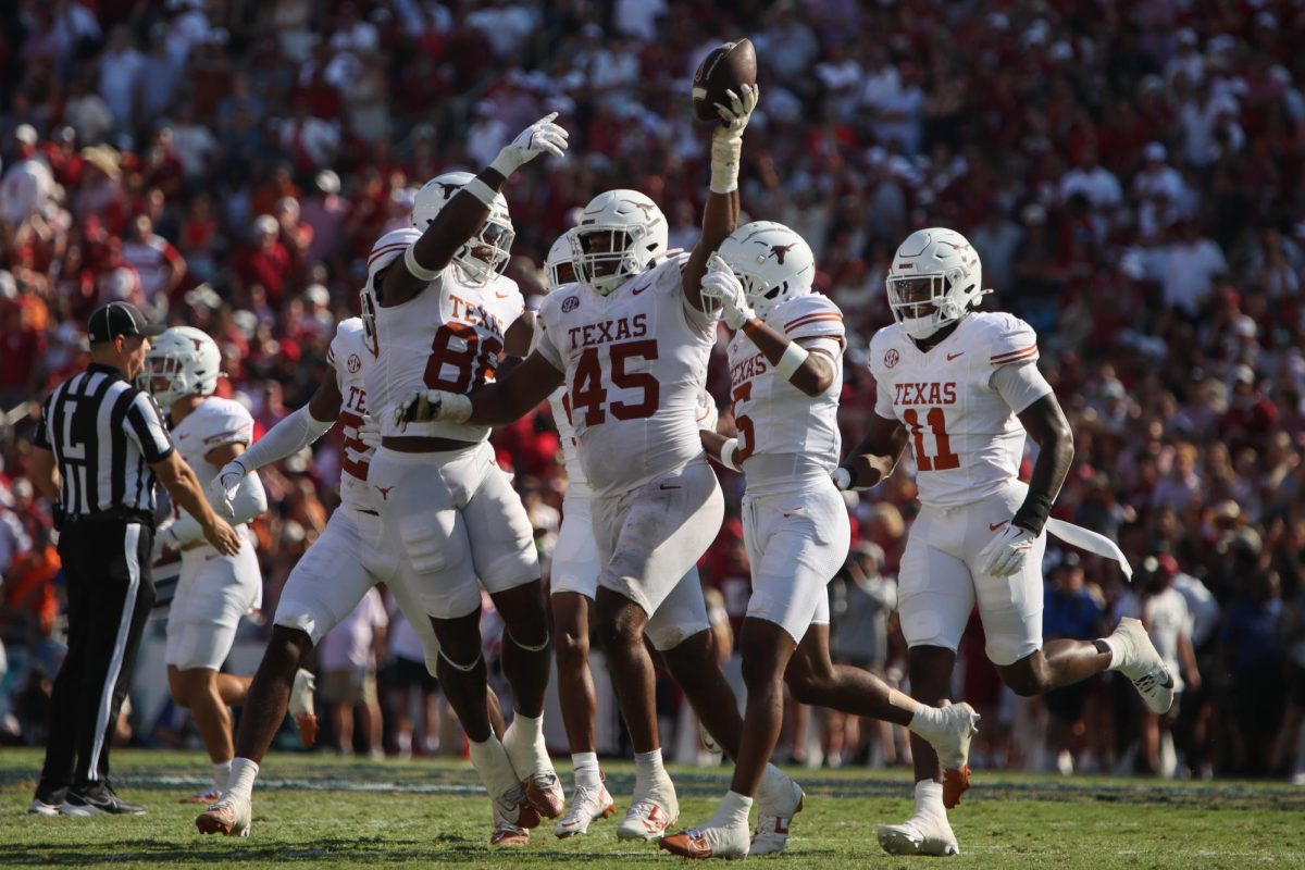 Defensive lineman Vernon Broughton holds the ball up after Oklahoma fumbled during the previous play of the Red River Rivalry game on Oct. 12, 2024.