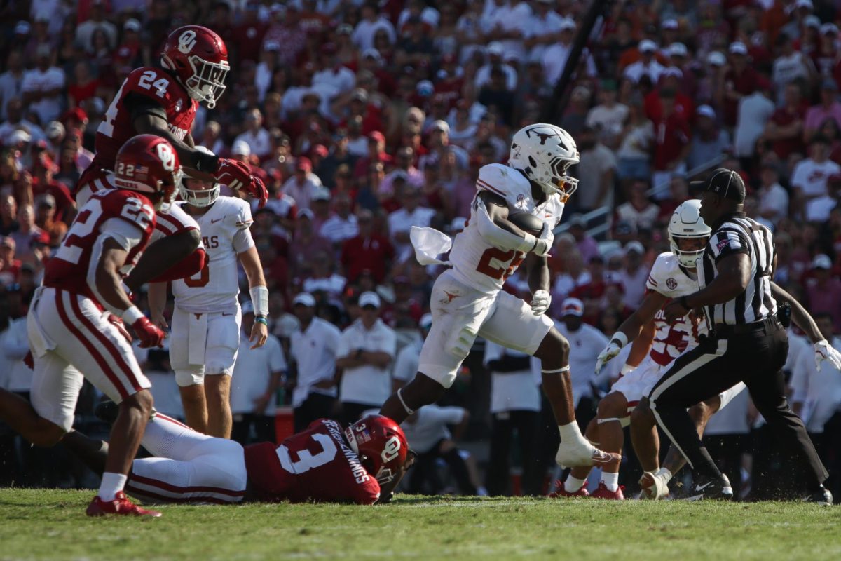 Runningback Quintrevion Wisner evades a tackle during the Red River Rivalry game on Oct. 12, 2024.