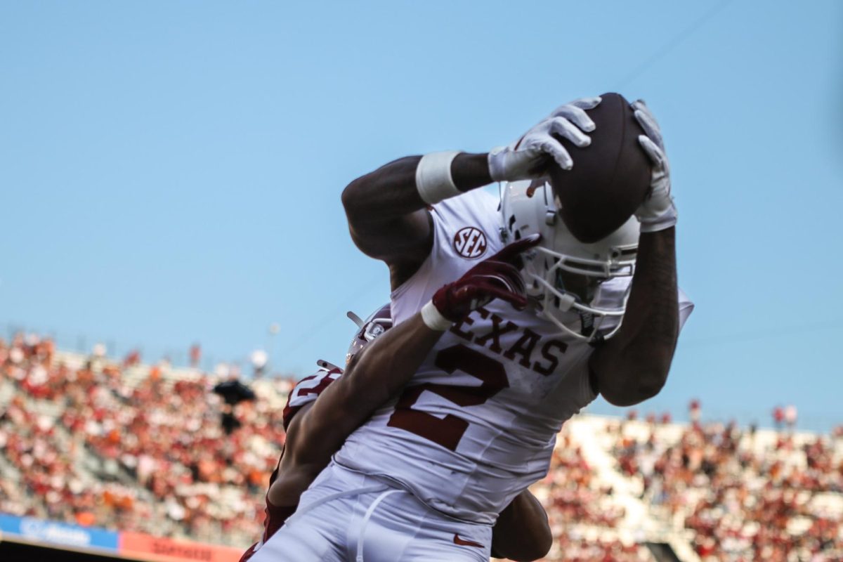 Wide receiver Matthew Golden gets tackled after catching the ball on Oct. 12, 2024.