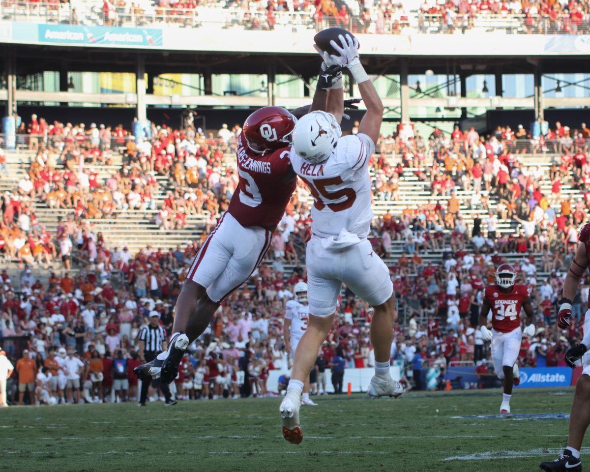 Tight end Gunnar Helm jumps to catch the ball during the Red River Rivalry game on Oct. 12, 2024. 