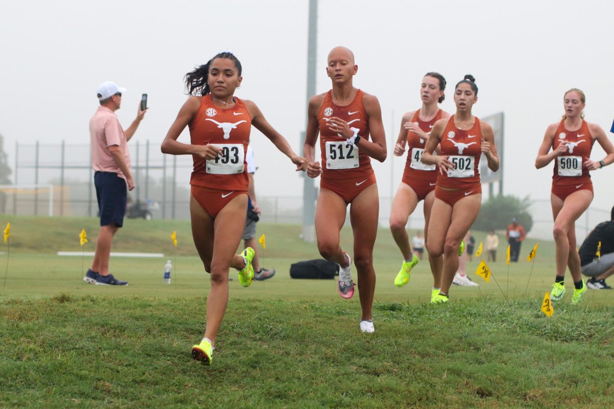 Marissa Espinoza runs down a hill at the Stormy Seas Invitational on Aug. 30, 2024.