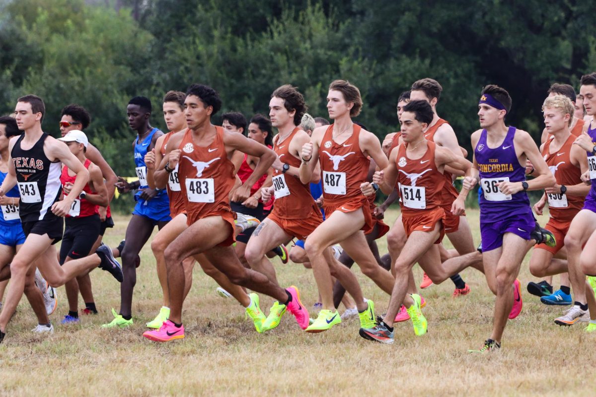 Graduate student Isaac Alonzo leads the Texas Cross Country team down the first 100-meters of the Stormy Seas Opener course on Aug. 30, 2024. 