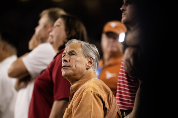 Texas Governor Greg Abbott watches the Longhorns' game against Alabama from the sidelines on September 9, 2023 at Bryant-Denny Stadium.