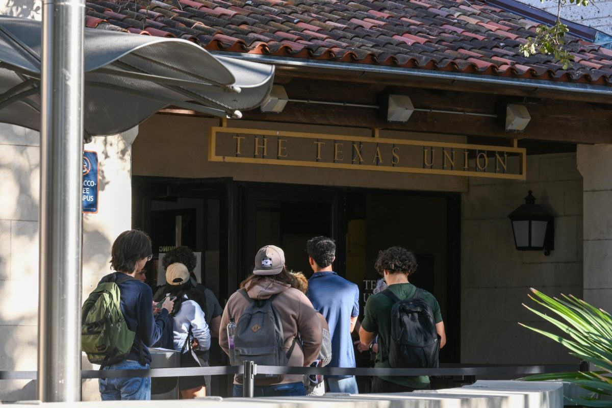 Students wait in line to early vote at the Texas Union on Oct. 22, 2024.