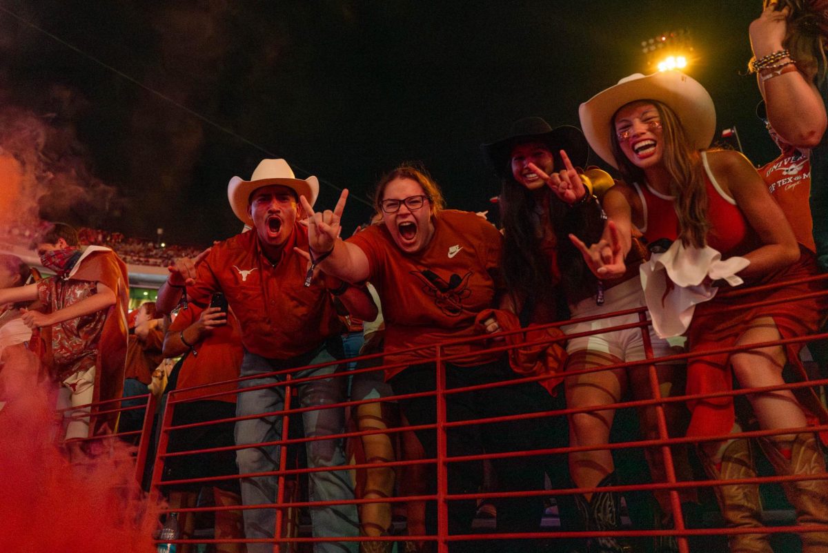 UT students cheer through an orange fog while "Thunderstruck" by AC/DC plays in Darrell K Royal Stadium ahead of the fourth quarter of Texas' game against UTSA on Sept. 14, 2024.