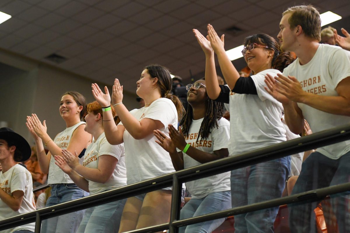 The Longhorn Hellraisers cheer at the Swim & Dive meet against Indiana on Nov. 1, 2024.