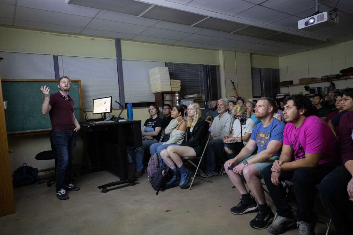 Luke Larter delivers a lecture on nocturnal callers in Austin for the Science Under The Stars outdoor lecture series at Brackenridge Field Laboratory on Nov. 7, 2024. The planned outdoor lecture was moved indoors to accommodate potential rainfall.