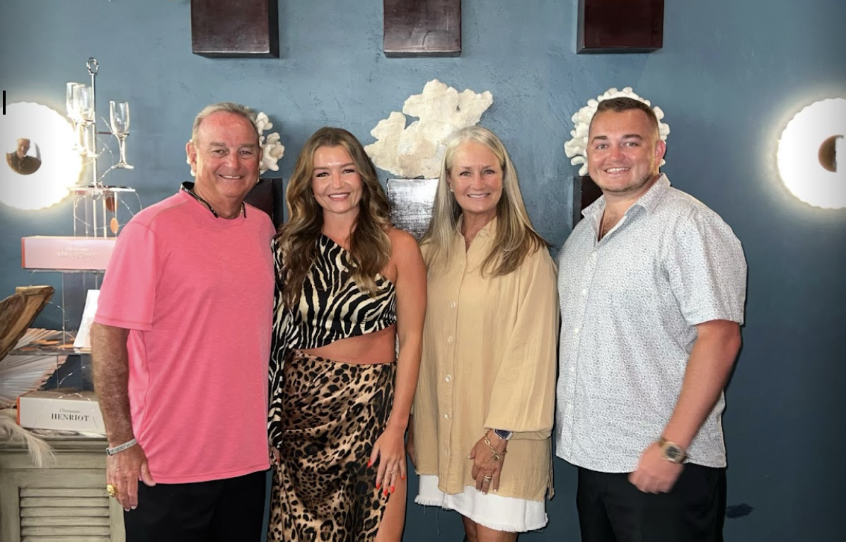 From left, Vic, Blair, Holly and Logan Schaefer stand for a photograph. 