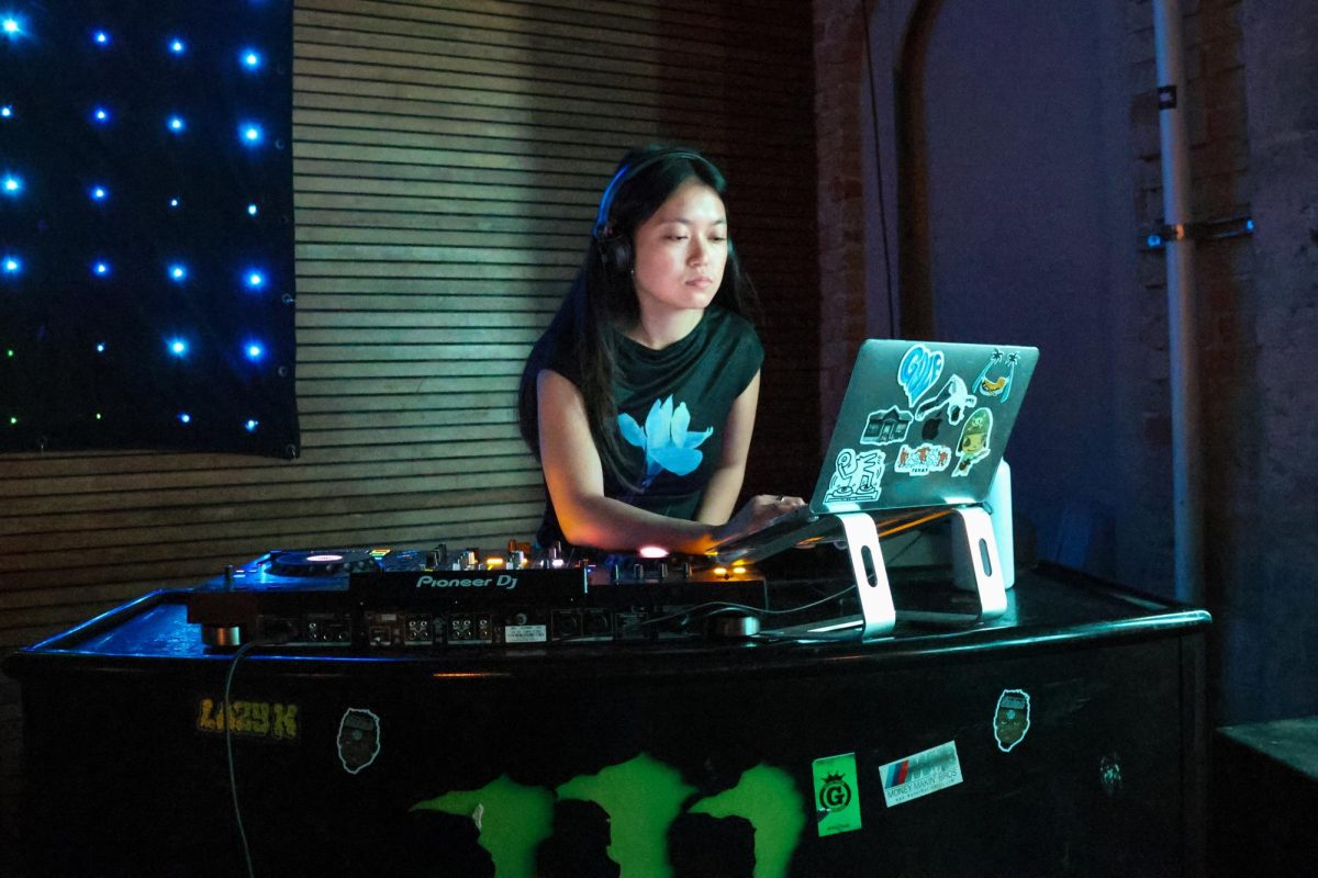 Theresa Nguyễn setting up her laptop and DJ board ahead of her set at New York New York Bar on November 15, 2024.