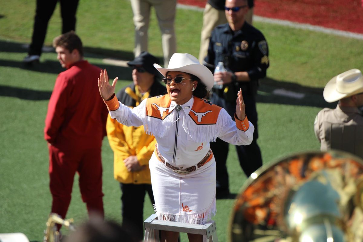 Longhorn Band Drum Major Jaiden Walker excites the band during the Texas-Arkansas game on Nov. 16, 2024. 