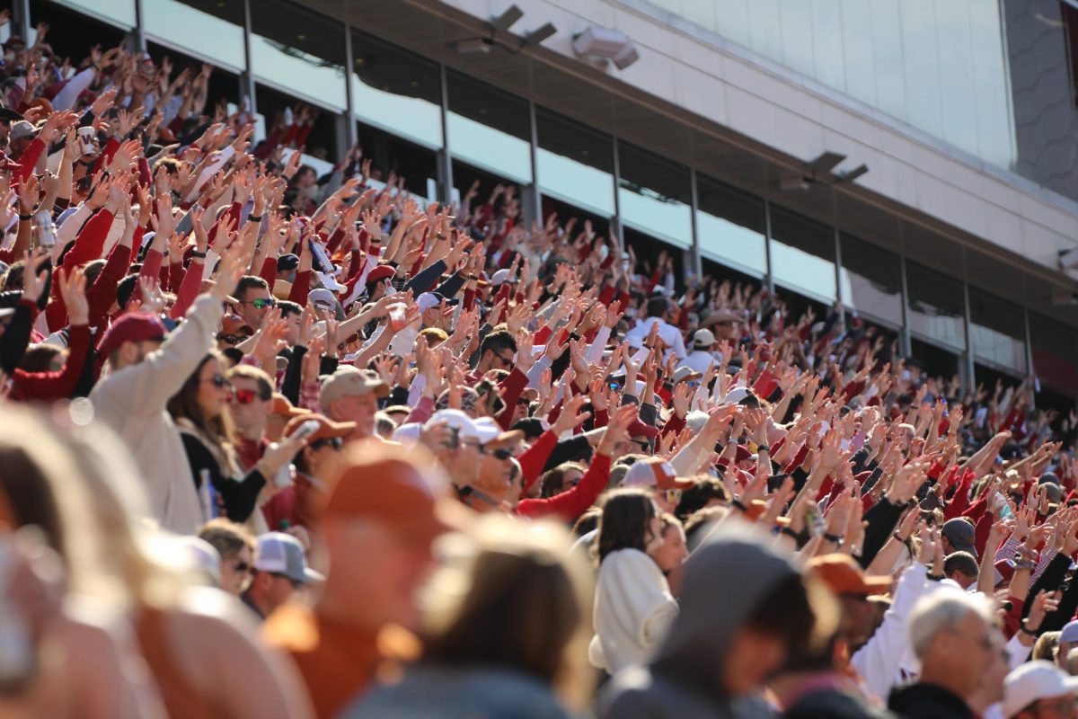 Fans return a 'hog call,' Arkansas' call and response, during the Texas-Arkansas game on Nov. 16, 2024. 