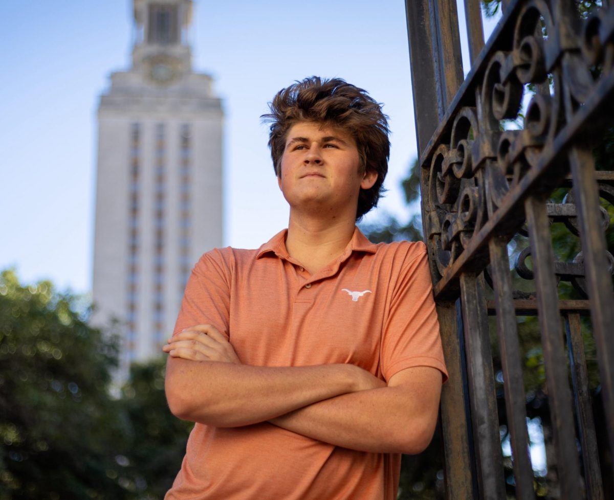 Grant Walther sports his viral burnt orange polo in front of the UT Tower on Nov. 19, 2024. 