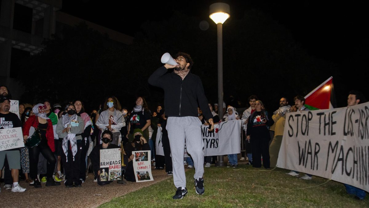 Student organizer Hadi demonstrates outside of the LBJ School of Public Affairs on Nov. 19, 2024.