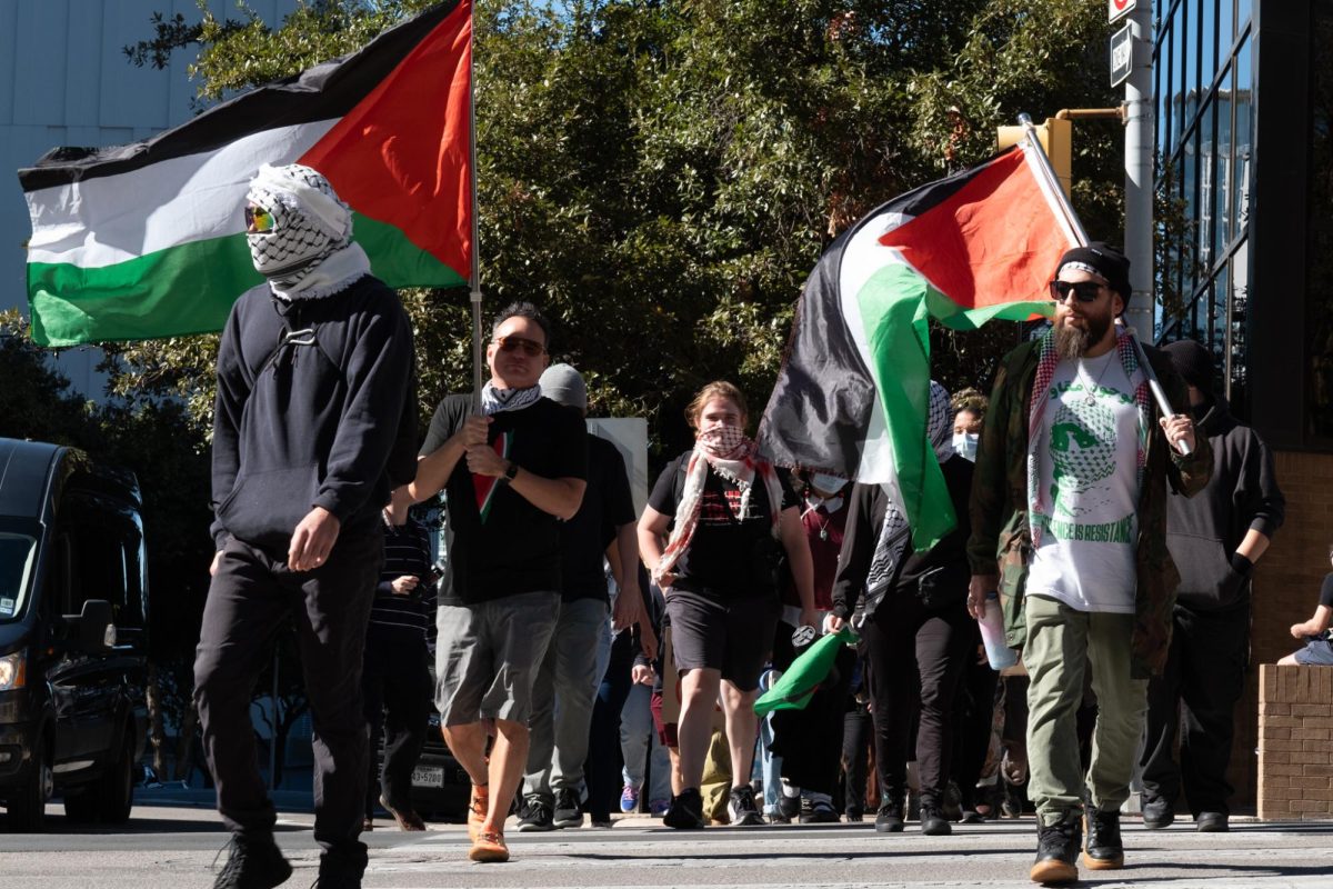 Demonstrators gathered near the University of Texas system building to protest corporations contributing to the ongoing war in Gaza at the quarterly Board of Regents meeting on Nov. 20, 2024.