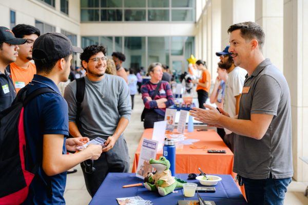 Timothy Myers talks to students about study abroad opportunities at the College of Natural Sciences First-Gen Celebration on Nov. 7, 2024.