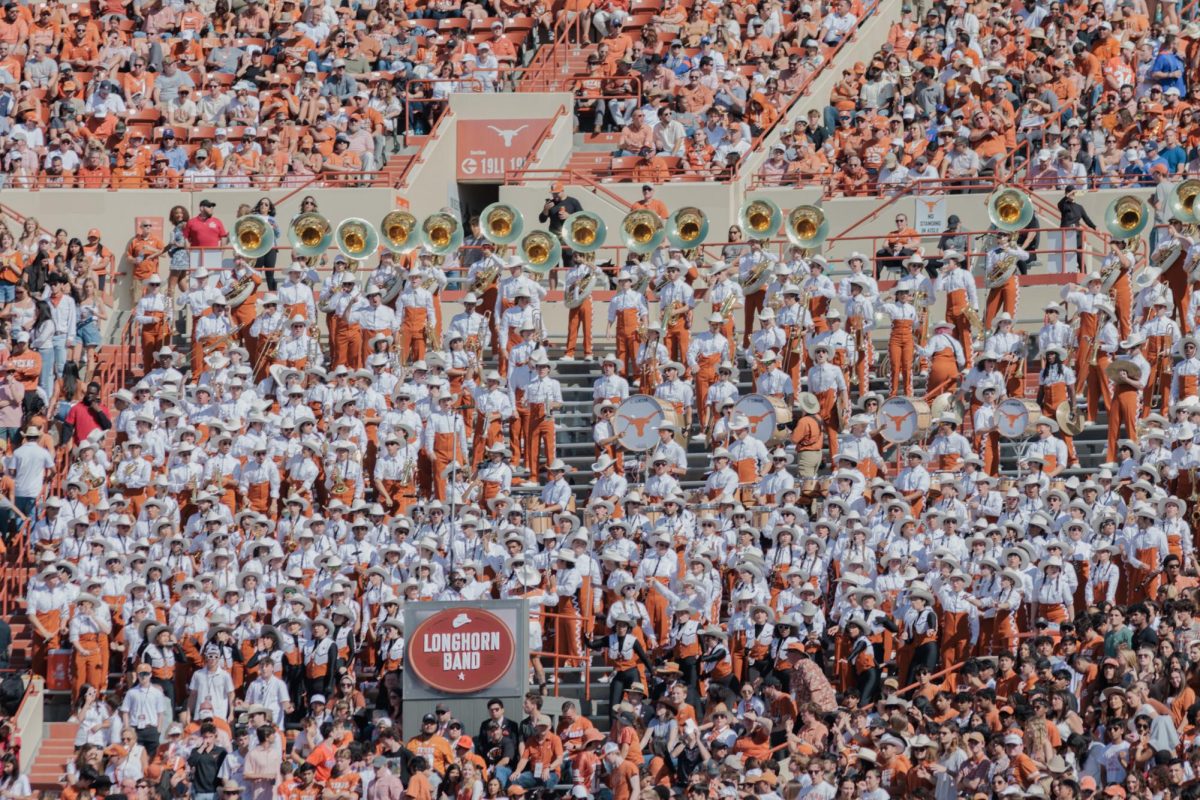 The University of Texas Longhorn band stands in their designated observation point at Darrell K Royal-Texas Memorial Stadium on November 9, 2024. 