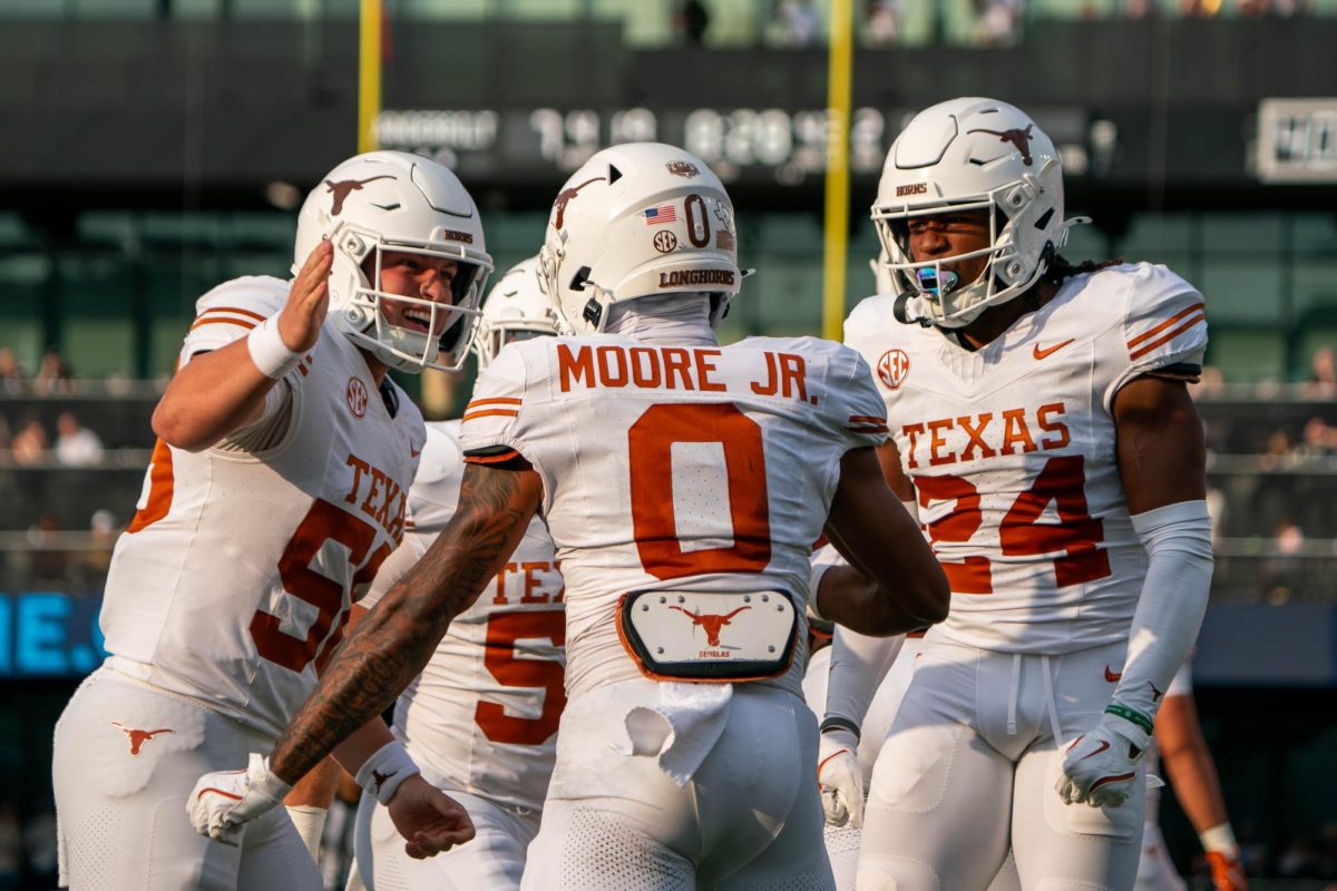 Wide receiver DeAndre Moore Jr. celebrates a play with deep snapper Lance St. Louis and defensive back Warren Roberson during Texas' game atVanderbilt on Oct. 26, 2024. 