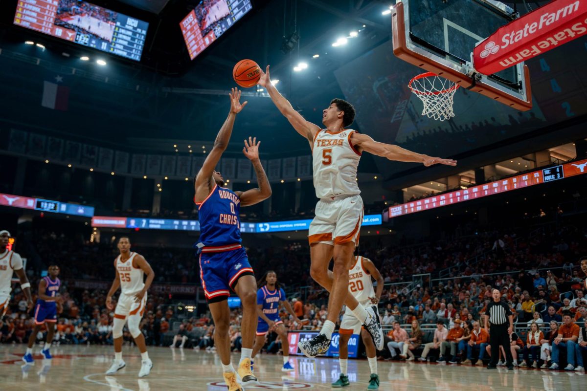 Graduate forward Kadin Shedrick blocks a shot during Texas’ game against HCU on Nov. 8, 2024. 