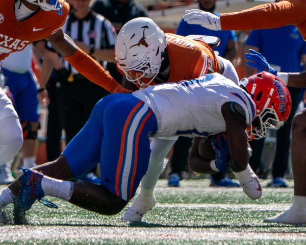 Defensive back Andrew Mukuba tackles Florida running back Jadan Baugh during Texas' game against the Gators on Nov. 9, 2024. 