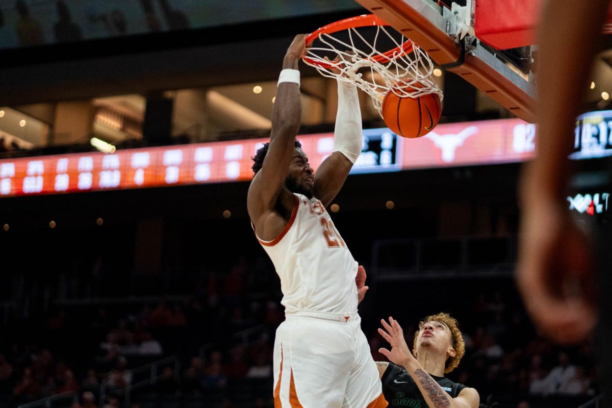 Senior forward Ze’Rick Onyama dunks during Texas' game against Chicago State on Nov. 12, 2024. 