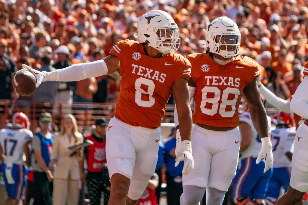 Edge Trey Moore celebrates after recovering a fumble during Texas' game against Florida on Nov. 9, 2024. 