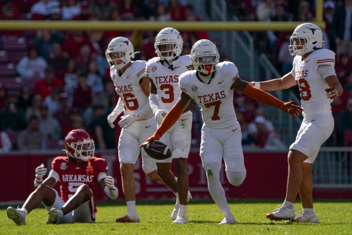 Defensive back Jahdae Barron celebrates an interception during Texas' game at Arkansas on Nov. 16, 2024. 