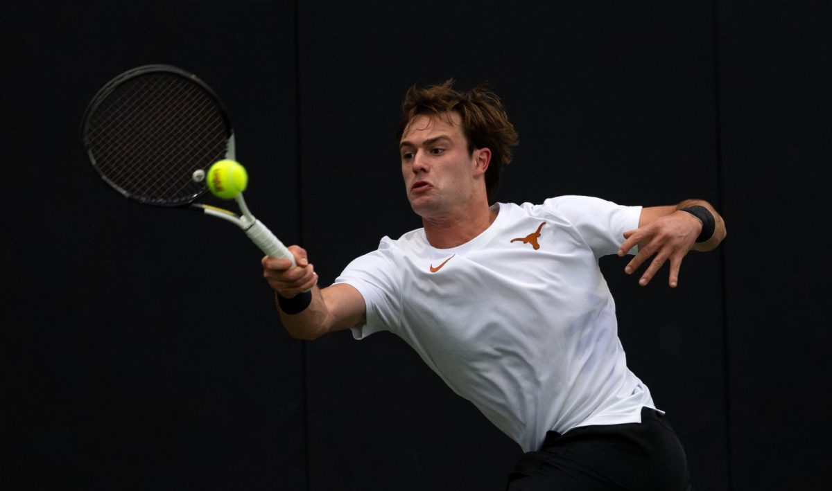 Junior Pierre-Yves Bailly hits the ball against Danilo Raicevic in singles play against St. John's University on Feb. 24. 