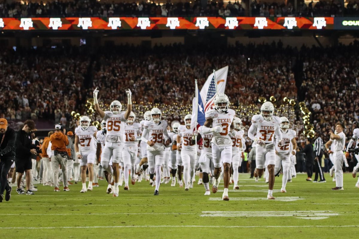 The Texas Longhorns Football team runs into Kyle Field prior to kickoff on Nov. 30, 2024.