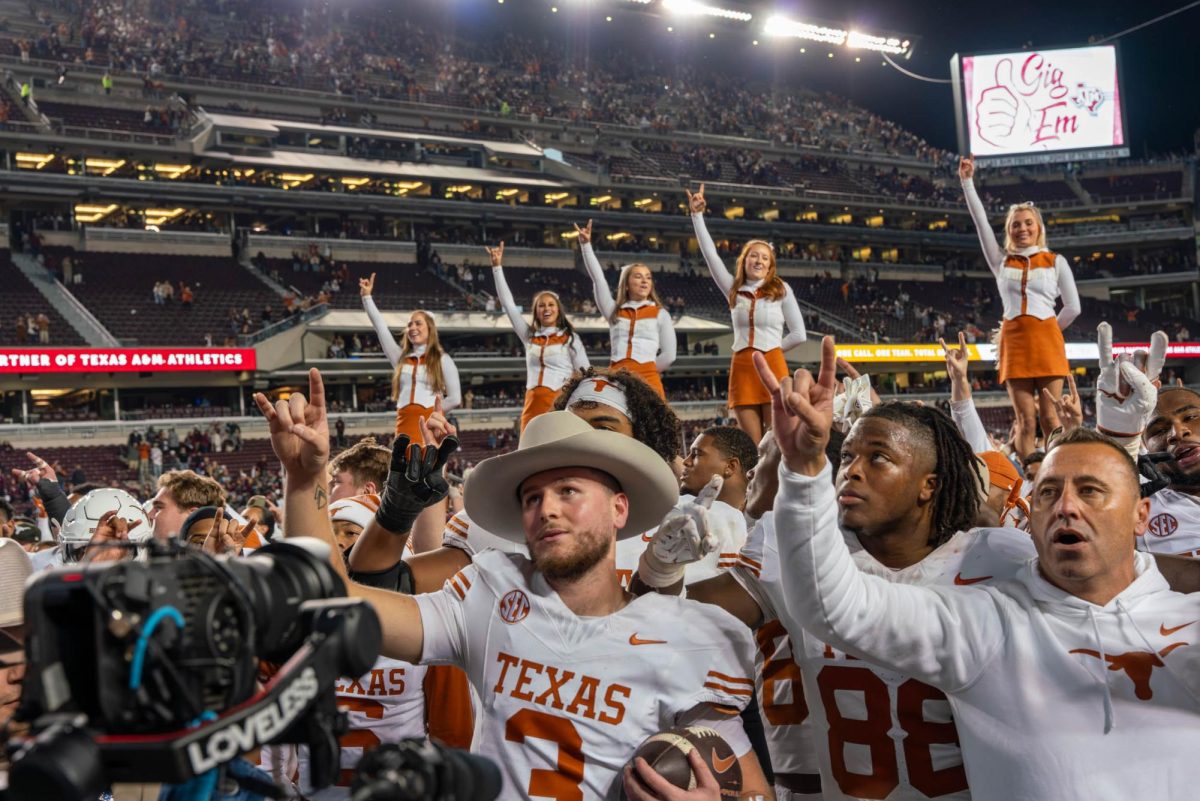 Texas team sing "The Eyes of Texas" following the 17-7 Lone Star Showdown win on Nov. 30, 2024. 