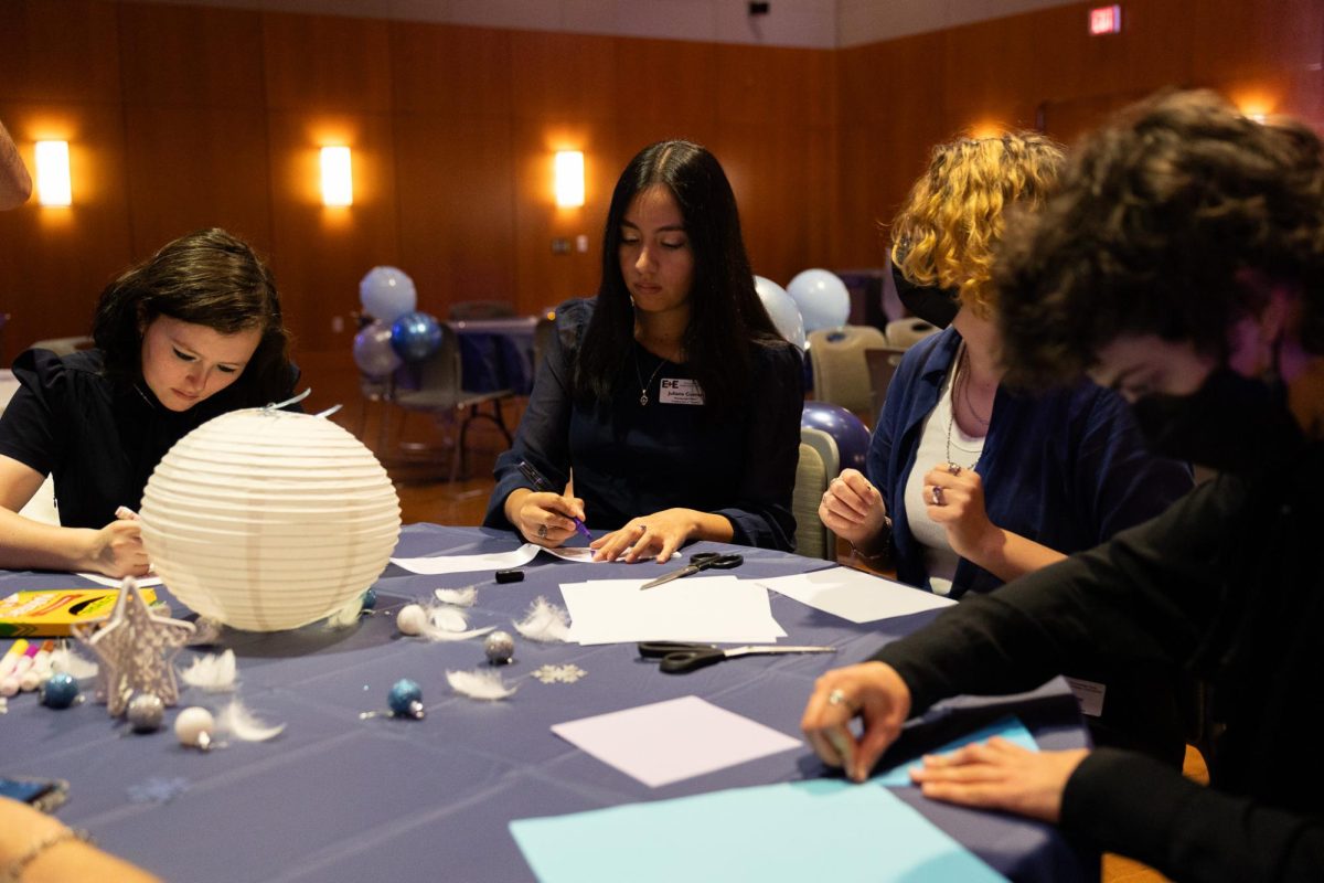 Students do arts & crafts at the Snowflake Solstice Ball hosted by Campus E+E's Creative Arts & Theater on December 4, 2024.