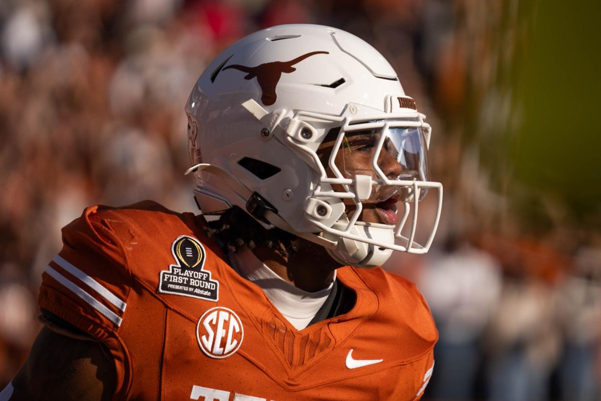 Running back Jaydon Blue yells after scoring a touchdown during Texas' home playoff game against Clemson on Dec. 21, 2024. 