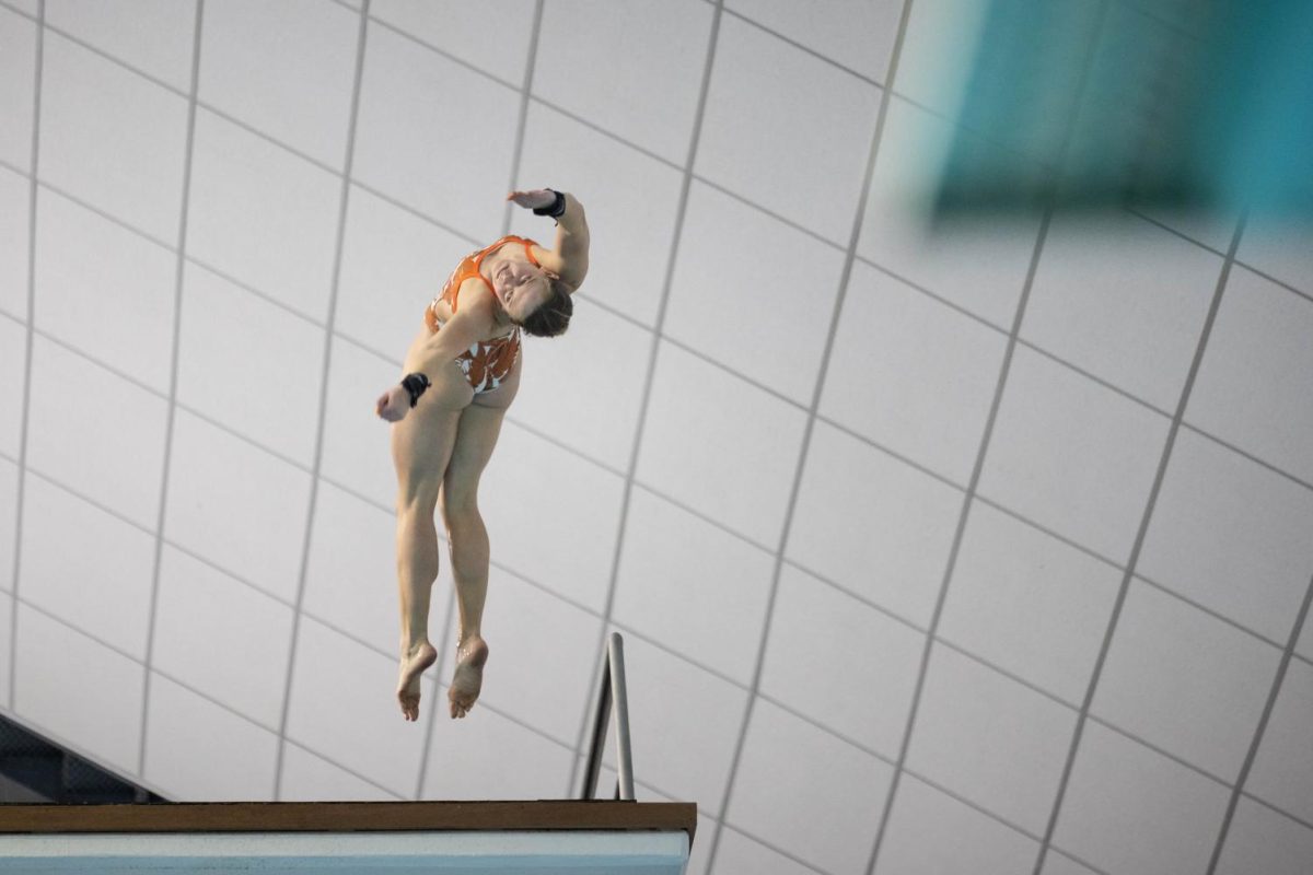 Divers compete in the Big 12 Swimming and Diving Championship at the Lee and Joe Jamail Texas Swimming Center on Feb. 25, 2022. The University of Texas was named Big 12 Champions for men's and women's events. 