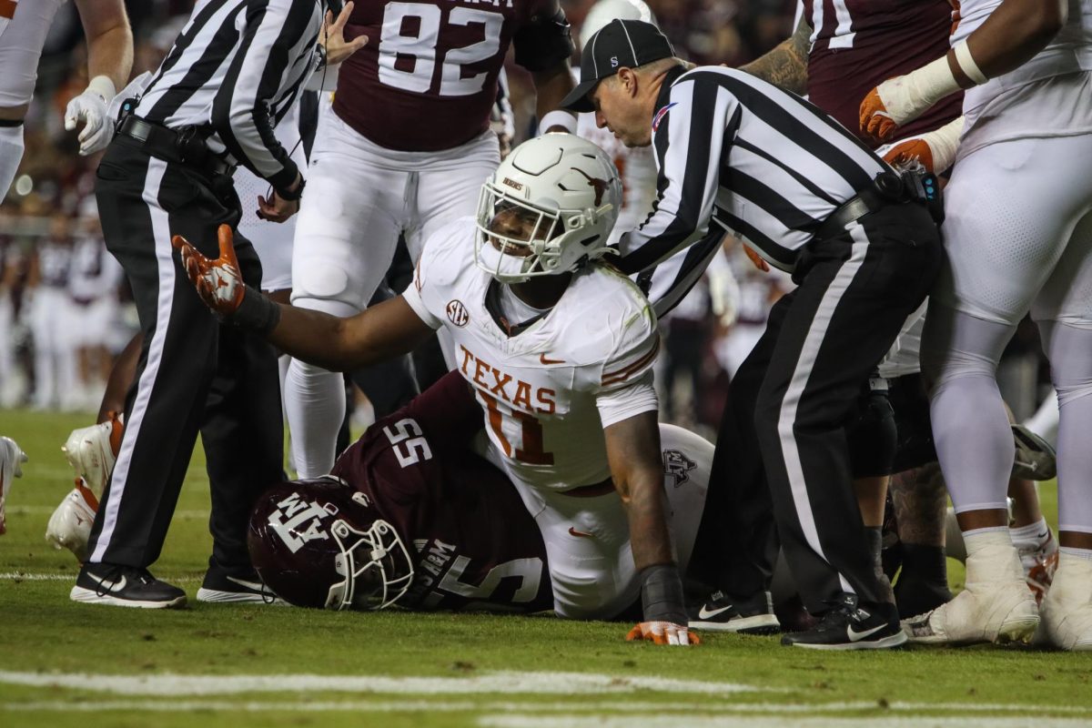 Edge Colin Simmons throws his hands up after being tackled by a Texas A&M player on Nov. 30, 2024.