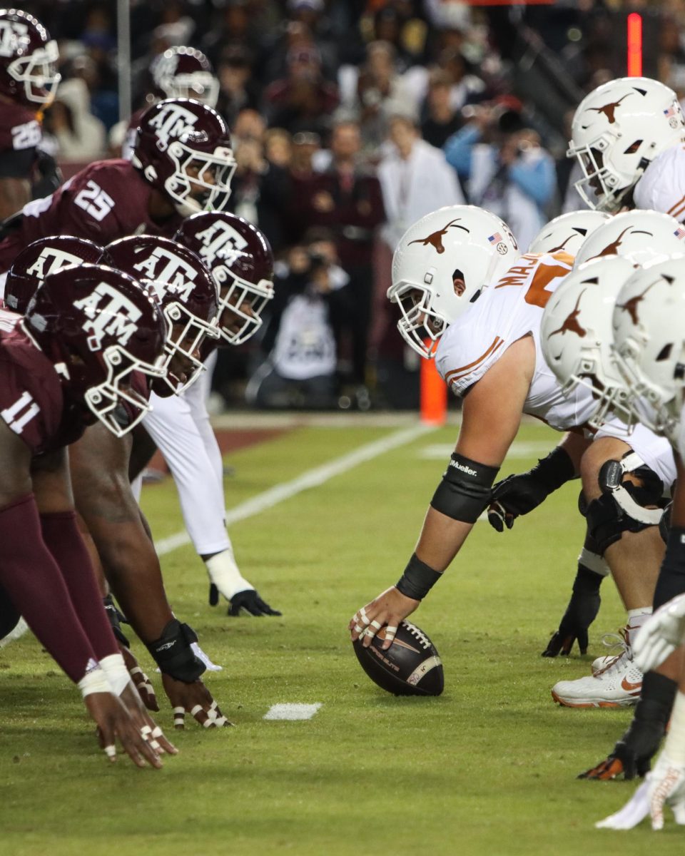 The Texas and Texas A&M football teams on the line of scrimmage waiting for the snap on Nov. 30, 2024.