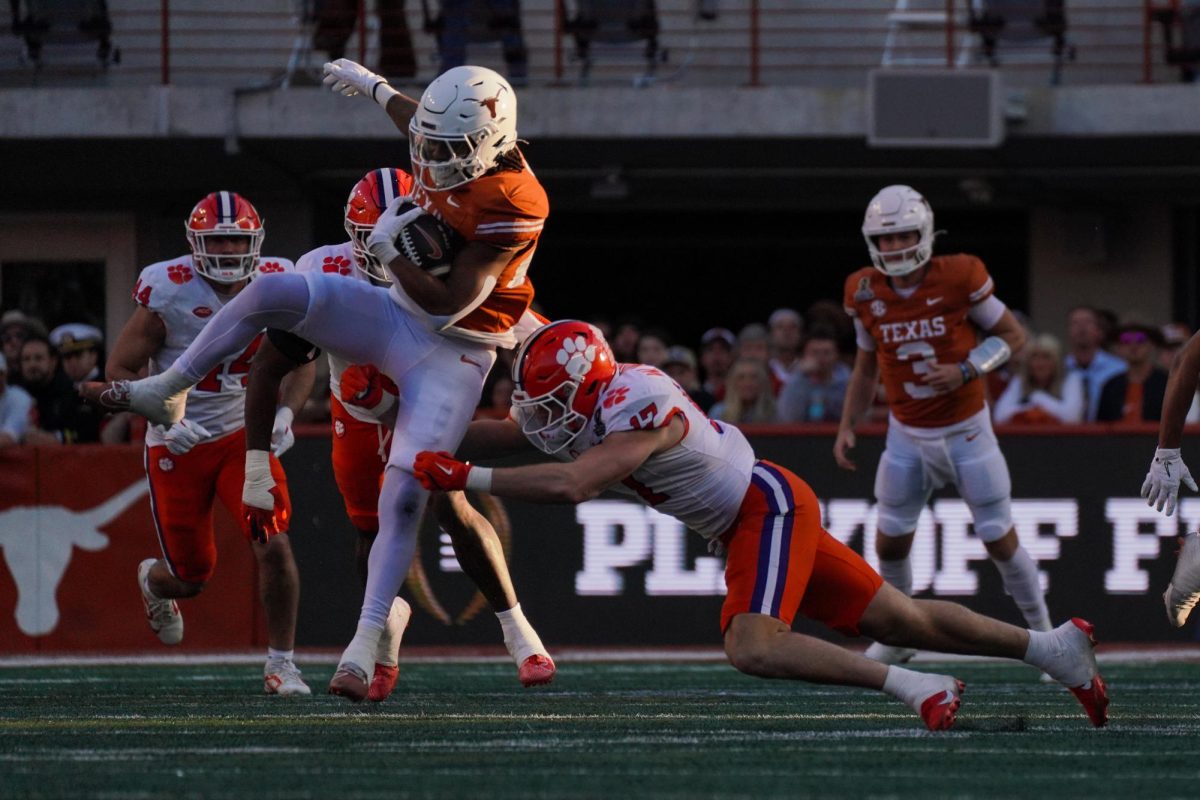 Running back Jaydon Blue evades a tackle during the first round playoff game against Clemson on Dec. 21, 2024.