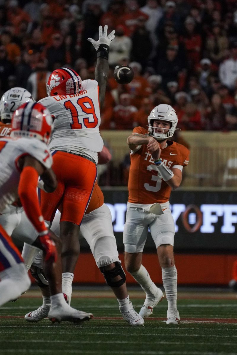 Quarterback Quinn Ewers makes a pass downfield during the first round playoff game against Clemson on Dec. 21, 2024.