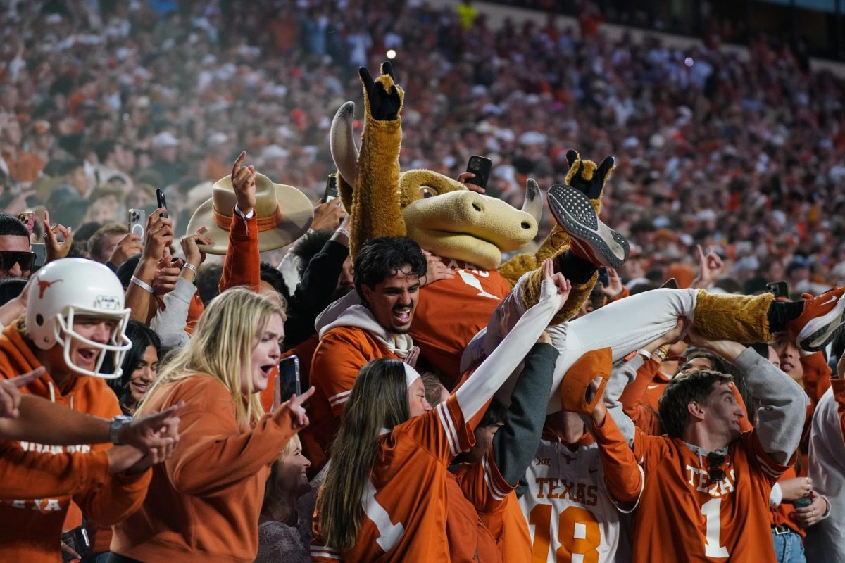 Students hoist Hook 'Em into the air at the end of the third quarter of the playoff game against Clemson on Dec. 21, 2024.