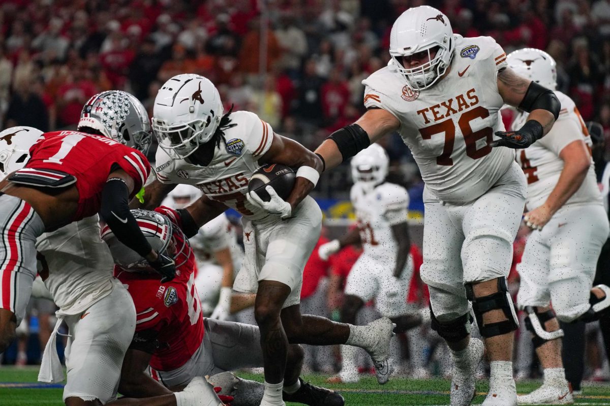 Offensive lineman Hayden Conner pushes Ohio State defenders to protect wide receiver Isaiah Bond during the Cotton Bowl Classic on Jan. 10, 2025.