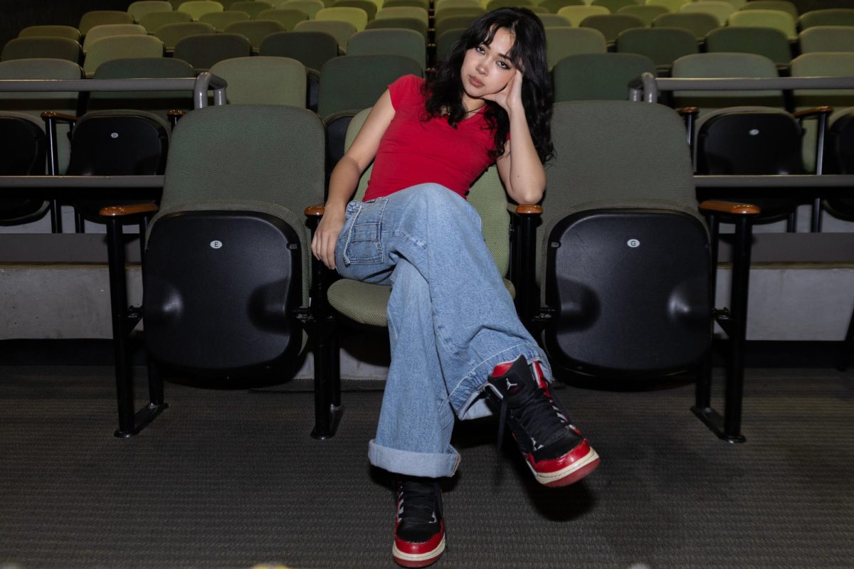 Natalie Tran sits in the middle of the Laboratory Theater on Jan. 14, 2025. Tran reached 1 million followers on Instagram the day before.