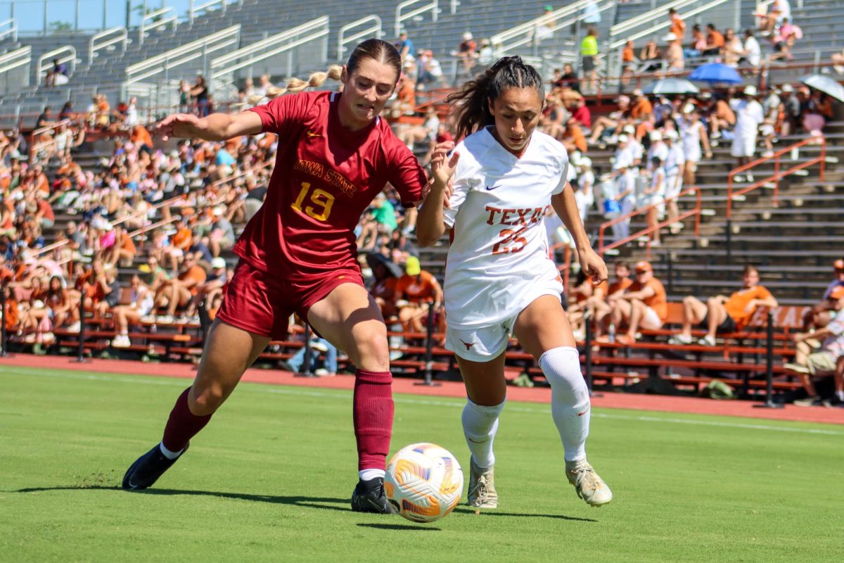 Senior defender Lauren Lapomarda blocks Iowa State forward Alex Campana from the ball on October 8, 2023.