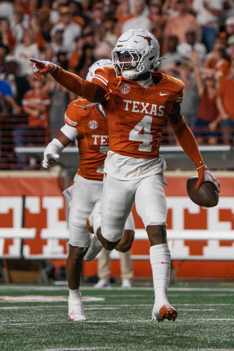 Defensive back Andrew Mukuba smiles after intercepting the ball during Texas' game against Kentucky on Nov. 23, 2024.