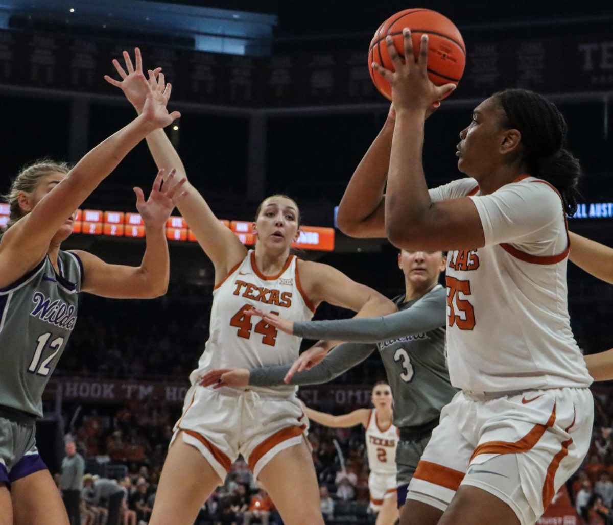 Freshman forward Madison Booker prepares to take a shot as senior forward Taylor Jones blocks opponents on Feb. 4, 2024. Booker and Jones contributed 33 points combined to the 61-54 upset win over Kansas State. 