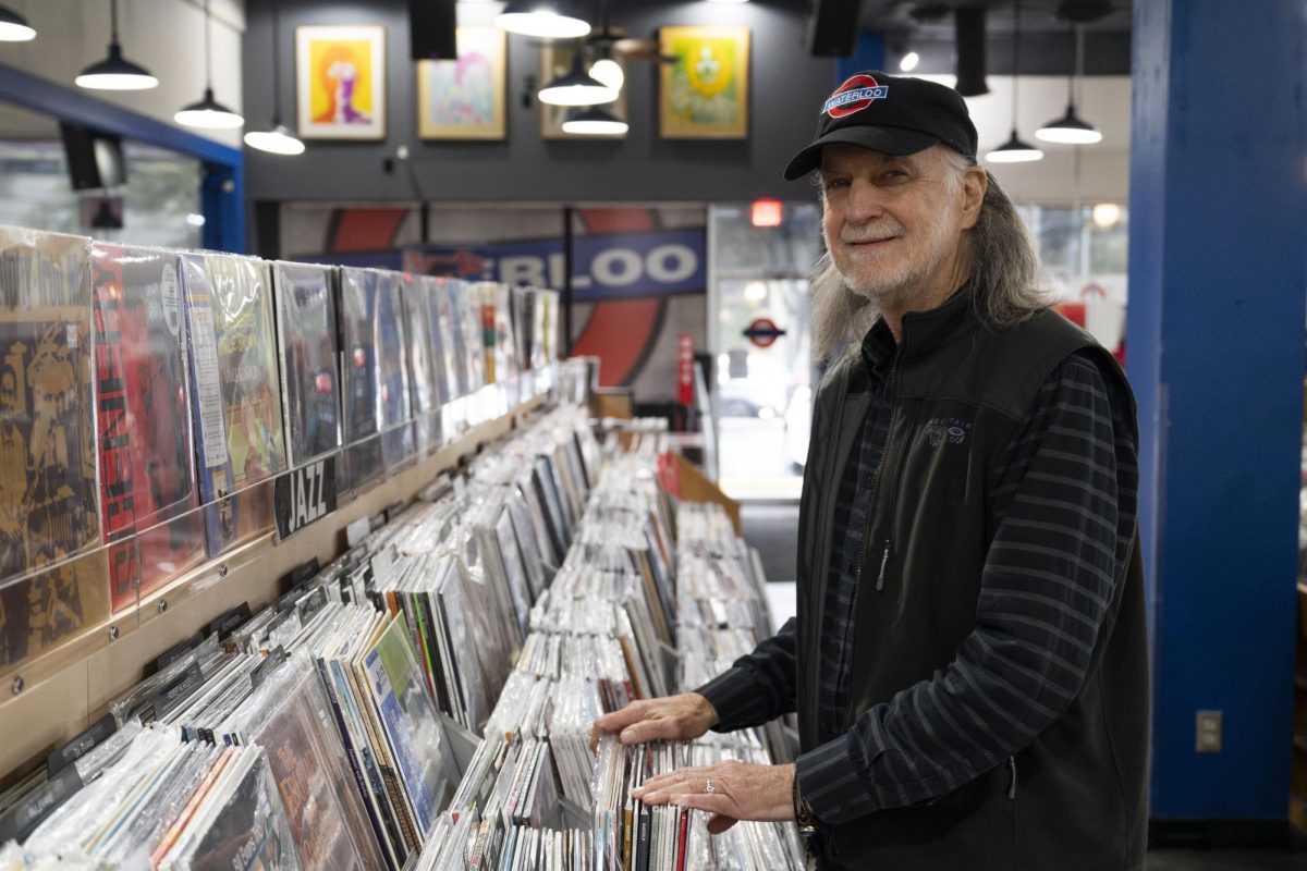 Former Waterloo Records & Video owner John Kunz poses for a portrait in his favorite section on Thursday, Jan. 9, 2025. Kunz owned the shop for 42 years.