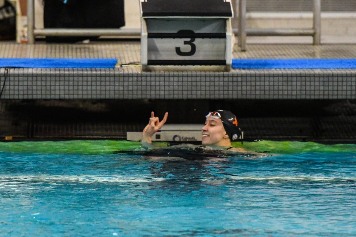 Abby Arens smiles after winning the 200-yard IM on Jan. 31, 2025. Arens swam 1:57.42 to take first place at the meet vs. Texas A&M.