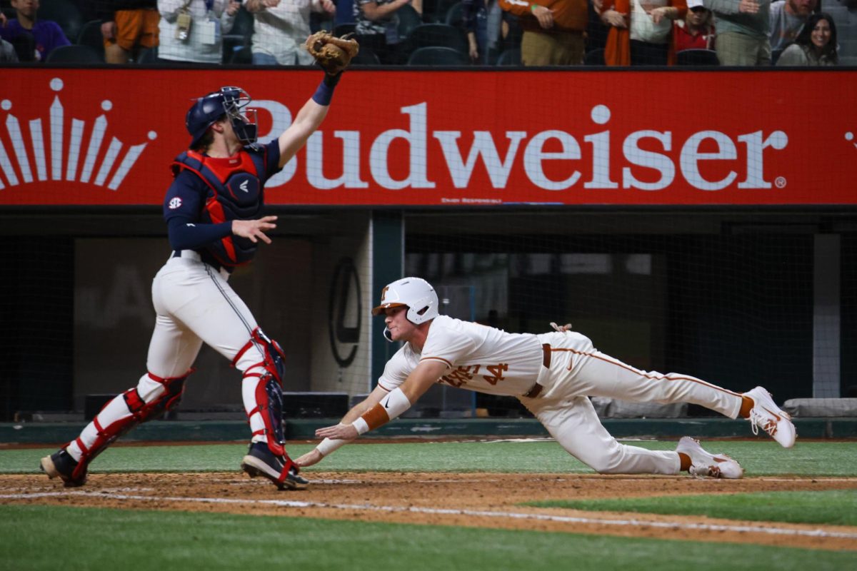 Junior outfielder Max Belyeu dives for home plate during Texas' game against Ole Miss Feb. 15, 2025. 