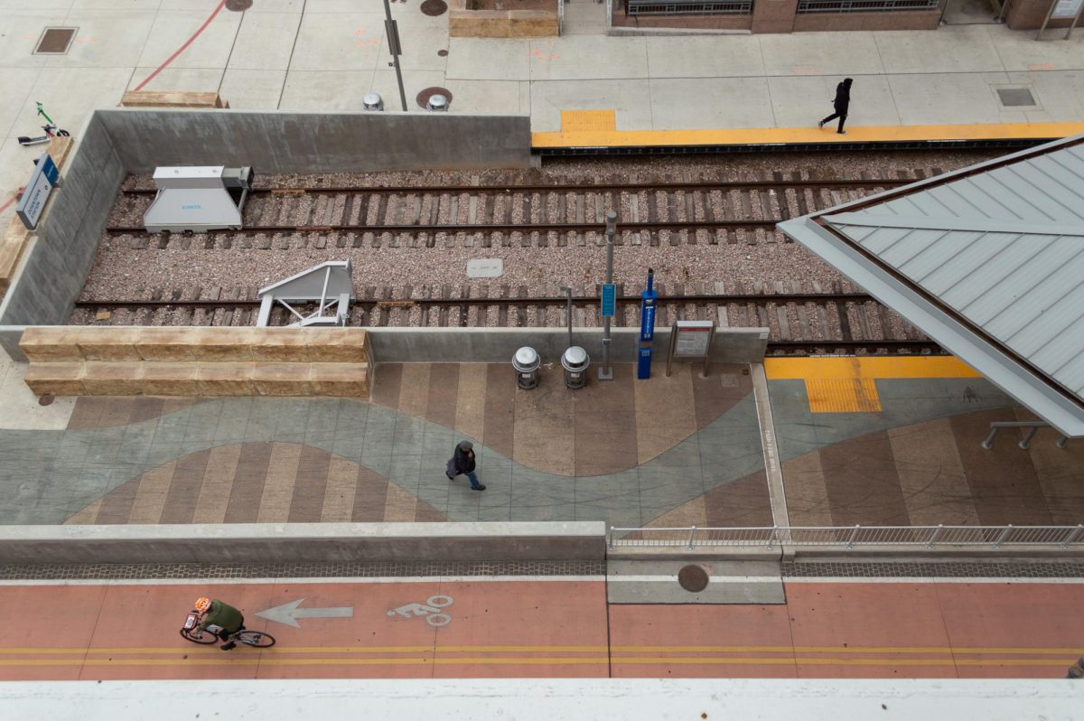 People walk and cycle around the train platform at the Downtown CapMetro rail station on Feb. 27, 2024.