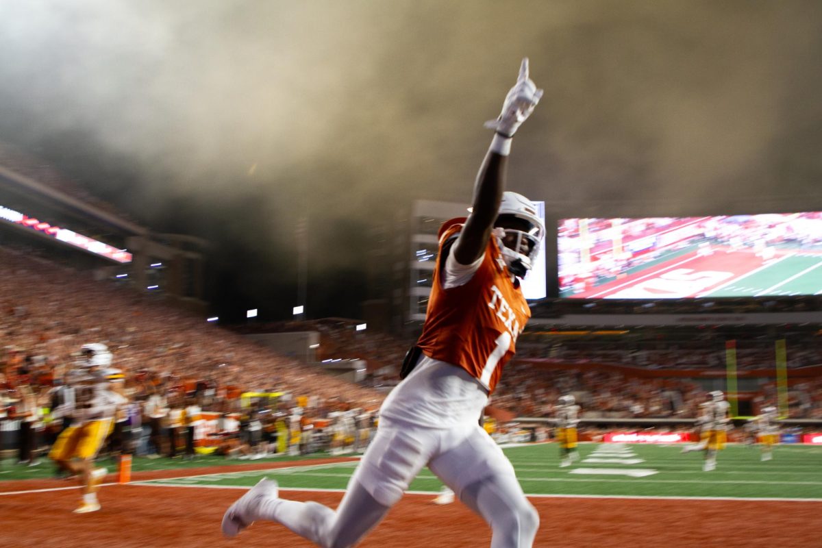 Wide receiver Xavier Worthy runs across the end zone after his touchdown during Texas' game against Wyoming on Sept. 16, 2023.