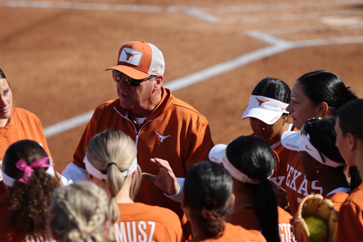 Head coach Mike White talks to his team during Texas’ game against Northwestern State University on March 1, 2024.